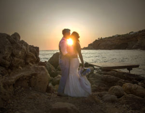 couple kiss with sunset